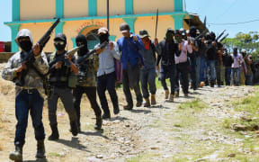 Members of the new self-defence group called "El Machete" parade during their presentation in Chiapas, Mexico on 18 July, 2021.