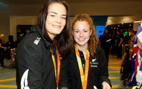 Holly Robinson (L) and Anna Grimaldi returning with medals from the 2016 Rio Paralympics.