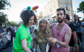 Israelis at the parade react to the stabbings.