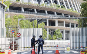 A road to the National Stadium, Olympic Stadium, is closed in Shinjuku, Tokyo on June 8, 2021. Traffic control around the stadium started on the same day ahead of the Tokyo Olympic Games opening ceremony.