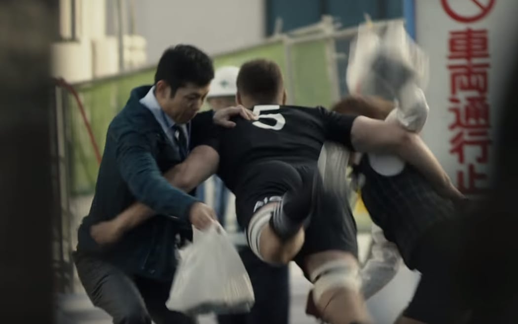 New Zealand Rugby is defending a new advertisement featuring the All Blacks after an anti-violence charity called it "excessively violent".