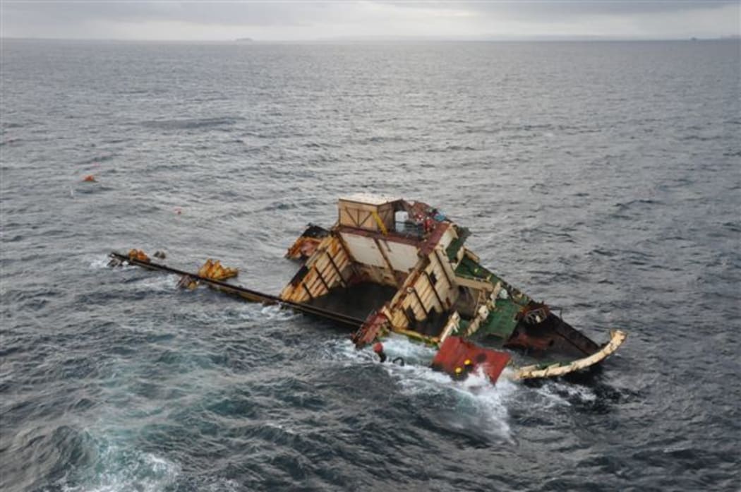 The bow of the Rena remains wedged on Astrolabe reef a year after it ran aground.