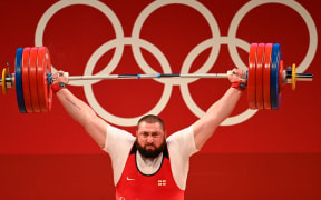 Georgia's Lasha Talakhadze competes in the men's +109kg weightlifting competition during the Tokyo 2020 Olympic Games.