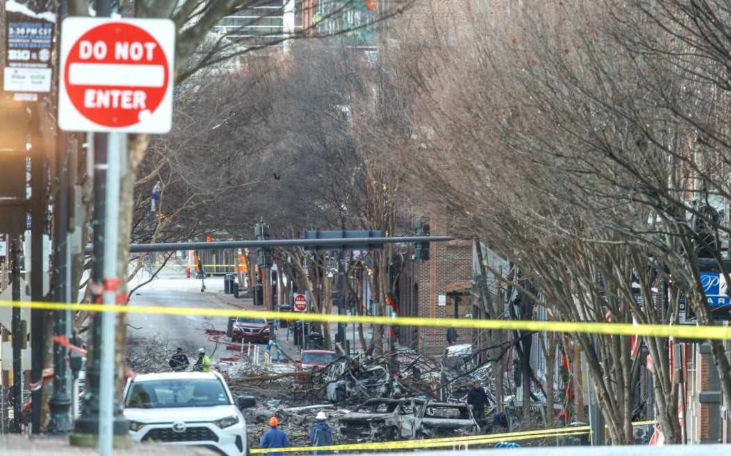 NASHVILLE, TENNESSEE - DECEMBER 25: Police close off an area damaged by an explosion on Christmas morning on December 25, 2020 in Nashville, Tennessee.