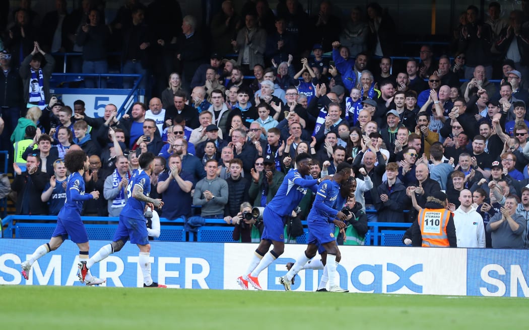 Chelsea players and fans celebrate.