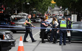 Police cordon off Bourke St following a stabbing incident in Melbourne.
