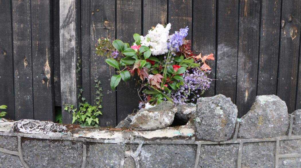 Flowers left at the site of the crash.