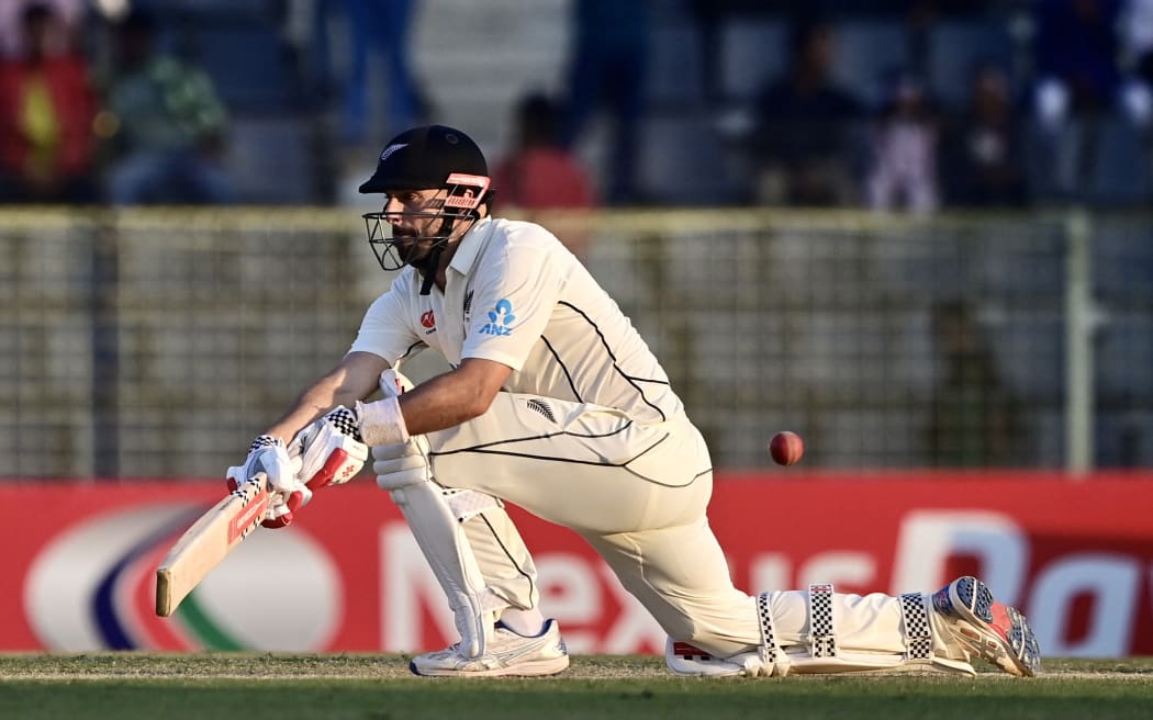 New Zealand’s Daryl Mitchell plays a shot during the fourth day of the first Test cricket match between Bangladesh and New Zealand at the Sylhet International Cricket Stadium in Sylhet on December 1, 2023. (Photo by Munir uz ZAMAN / AFP)