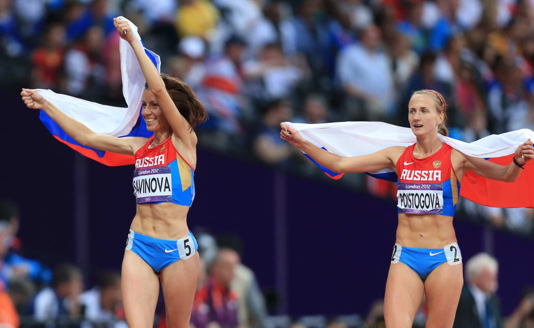 Russian athletes Mariya Savinova (left) Ekaterina Poistogova celebrate their 800m gold and bronze medal success at the London Olympics.