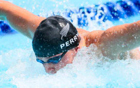 Sam Perry competing in the men's 50m butterfly heat.