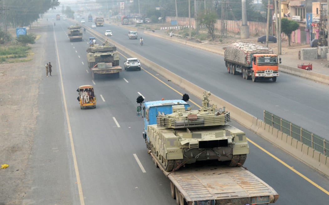 Trucks transport army tanks on a road in Muridke, about 30 kilometres from Lahore, on May 7, 2025.