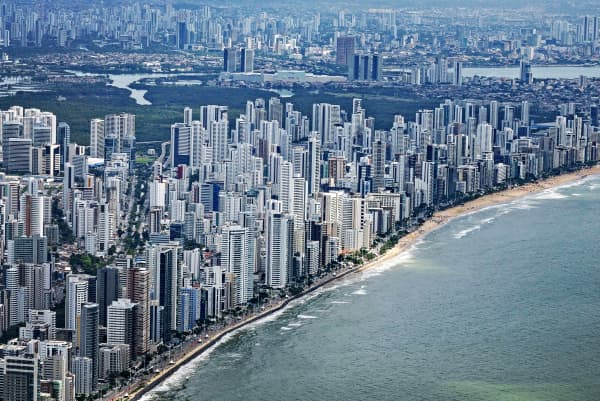 Many skyscrapers are stacked together along the coast of the Brazilian city of Recife.