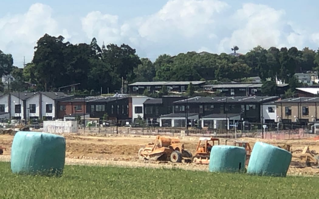 Hay bales in the foreground tell you what this housing development used to look like.