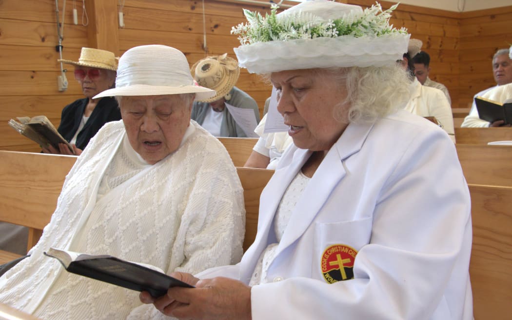 Members of the congregation sing at the Christmas service recording for RNZ.