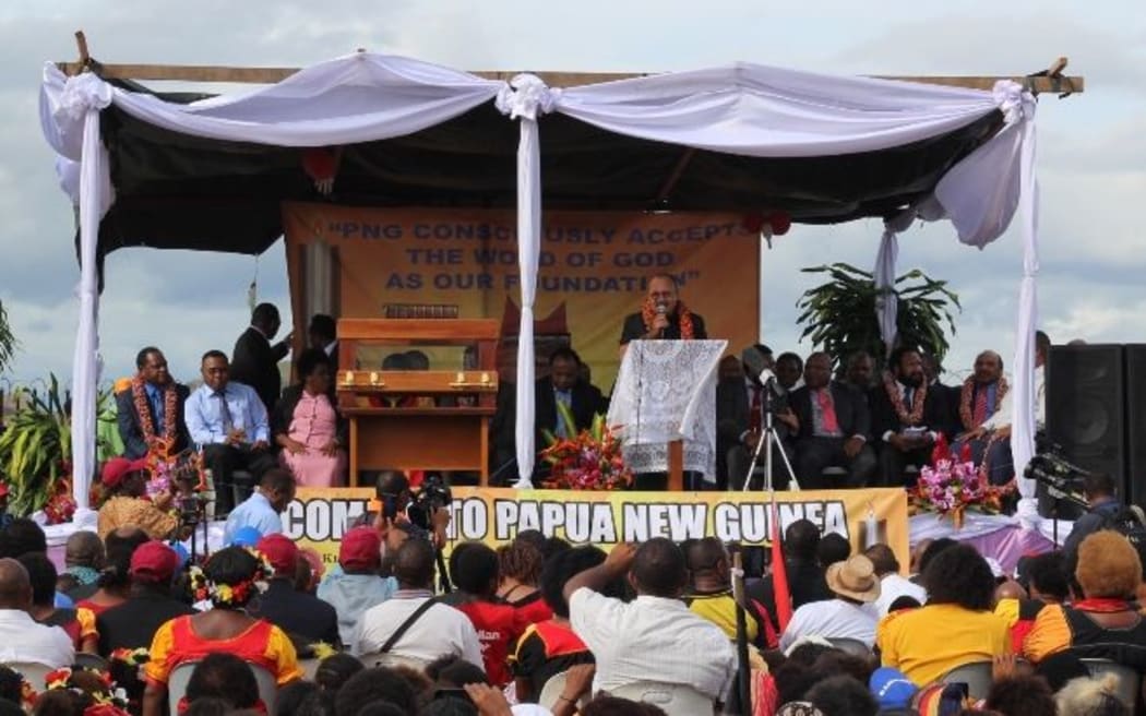 Papua New Guinea's Prime Minister Peter O'Neill speaks at a reception for a first edition of the King James Bible given to PNG by a private US donor.