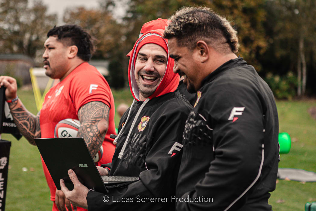 Tonga prop Siegfried Fisi'ihoi (R) is all smiles during training.