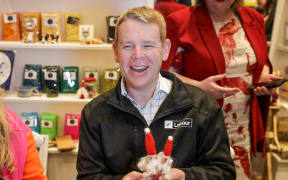 Labour Party leader Chris Hipkins gives us arts and crafts a go at a shop in Christchurch.