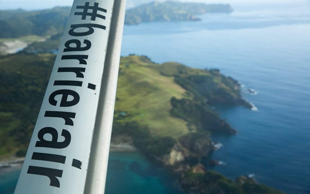 The underside of a Barrier Air plane as it departs Auckland for Great Barrier Island.