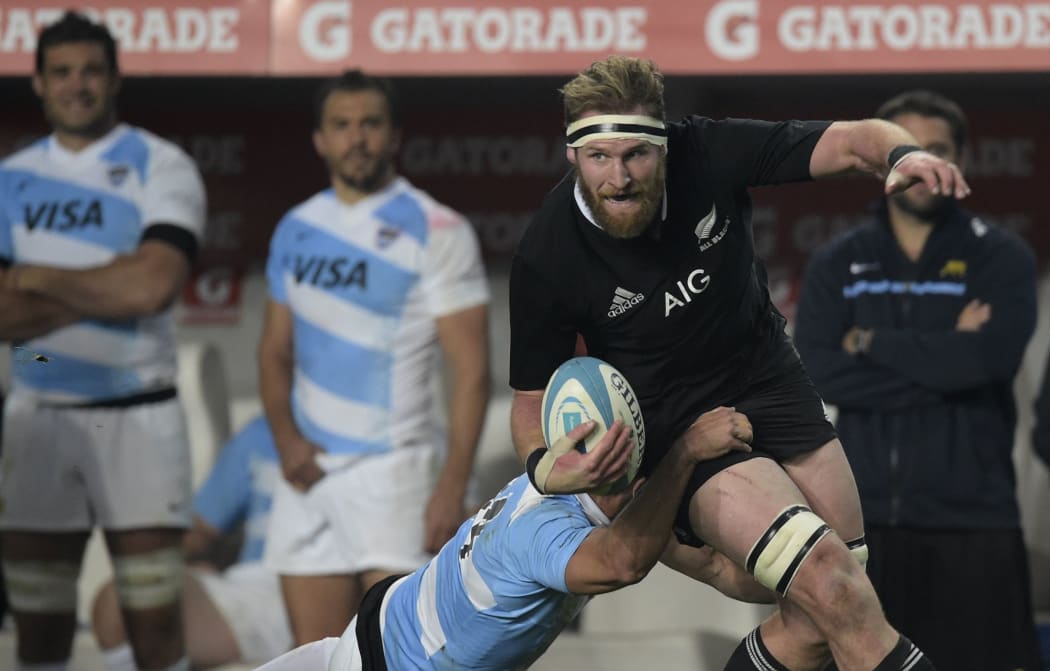 All Blacks Number 8 Kieran Read runs through a tackle by Argentina's Los Pumas' wing Juan Imhoff during the 2014 Rugby Championship.