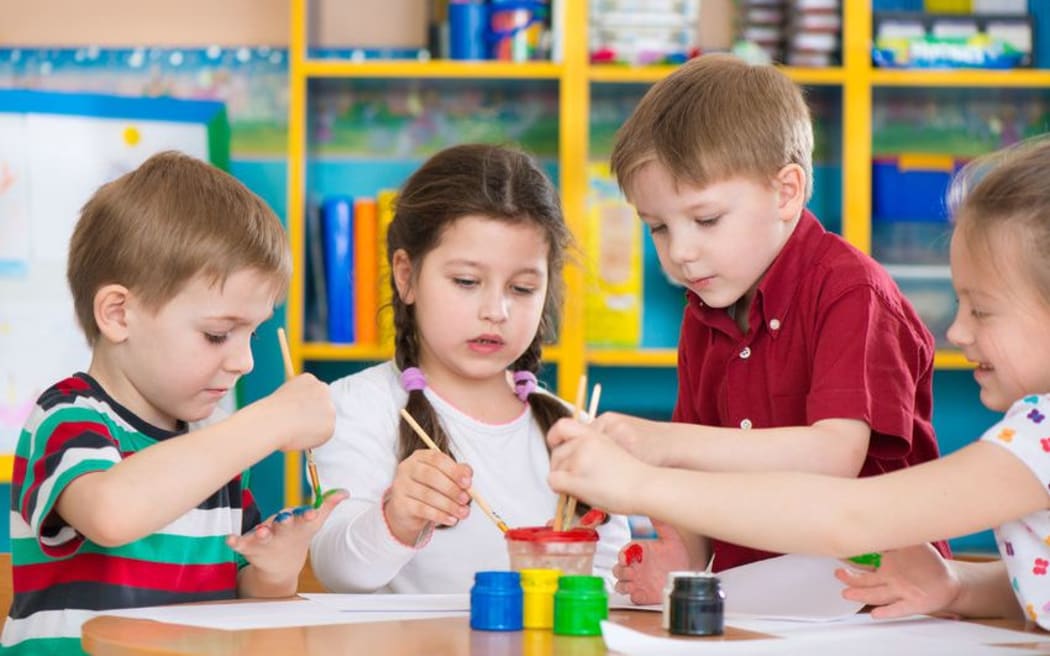 children painting at preschool