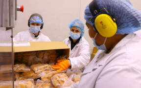 Tegel head office workers Anna and Maureen join Rasela on the production line at Tegel's Henderson poultry factory.