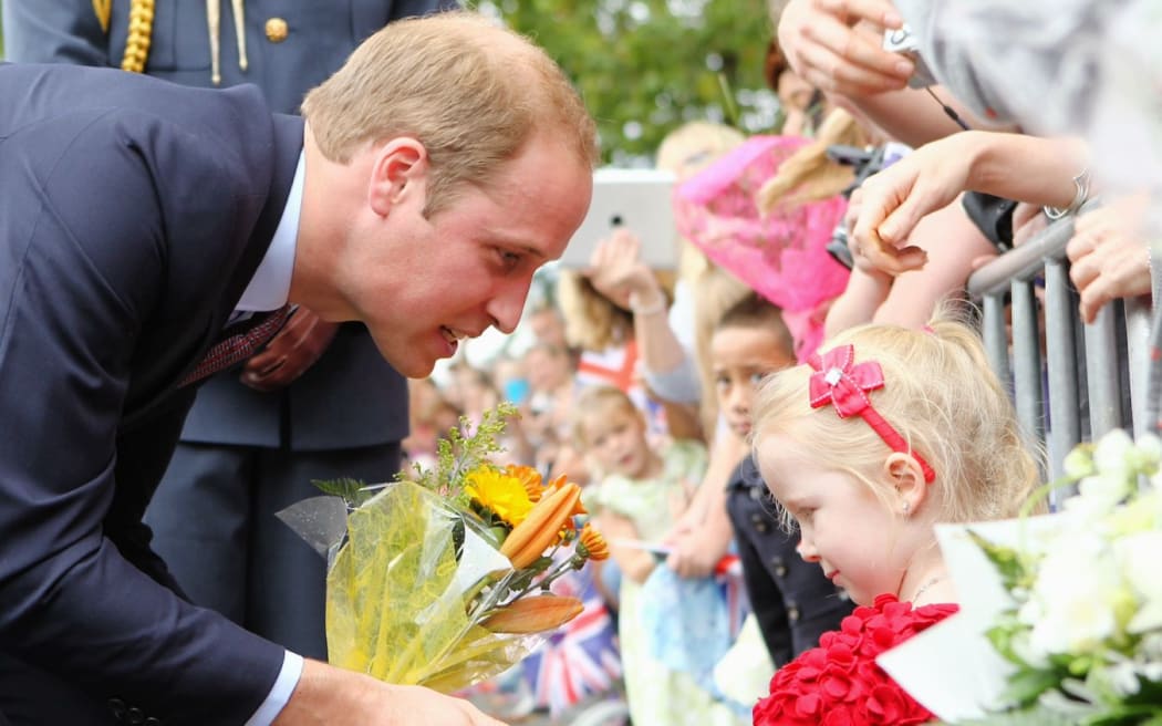 The Duke of Cambridge greets a young fan.