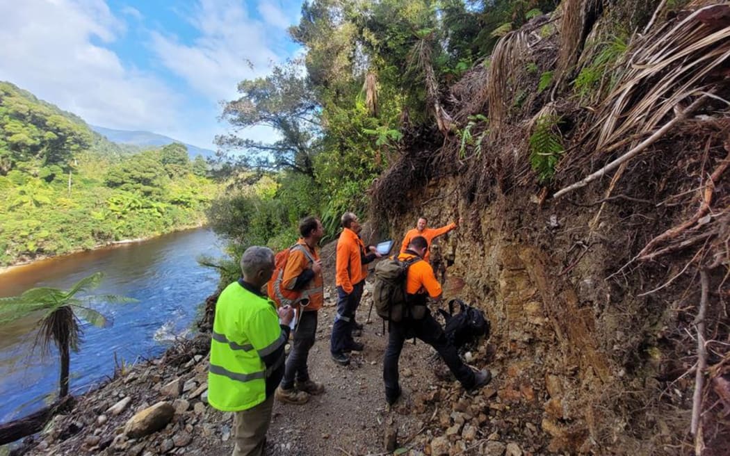 DOC and contracting staff visit the anchor site for the new Heaphy River bridge on the true right bank. Abseil Access have been awarded to DOC contract to build the two-bridge solution of new bridges across the Heaphy and Lewis rivers after the former lower level Heaphy bridge was destroyed by Cyclone Dovi.