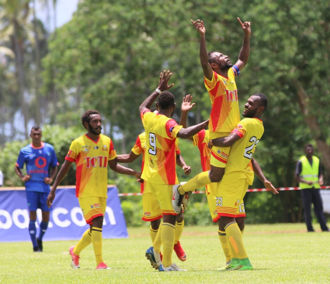 Lae City captain Raymond Gunemba is embraced after scoring against Lautoka FC.