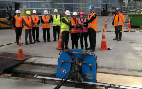 Gallery director Jenny Harper and Christchurch mayor Lianne Dalziel were their for the final cutting of concrete to finish base isolation work.