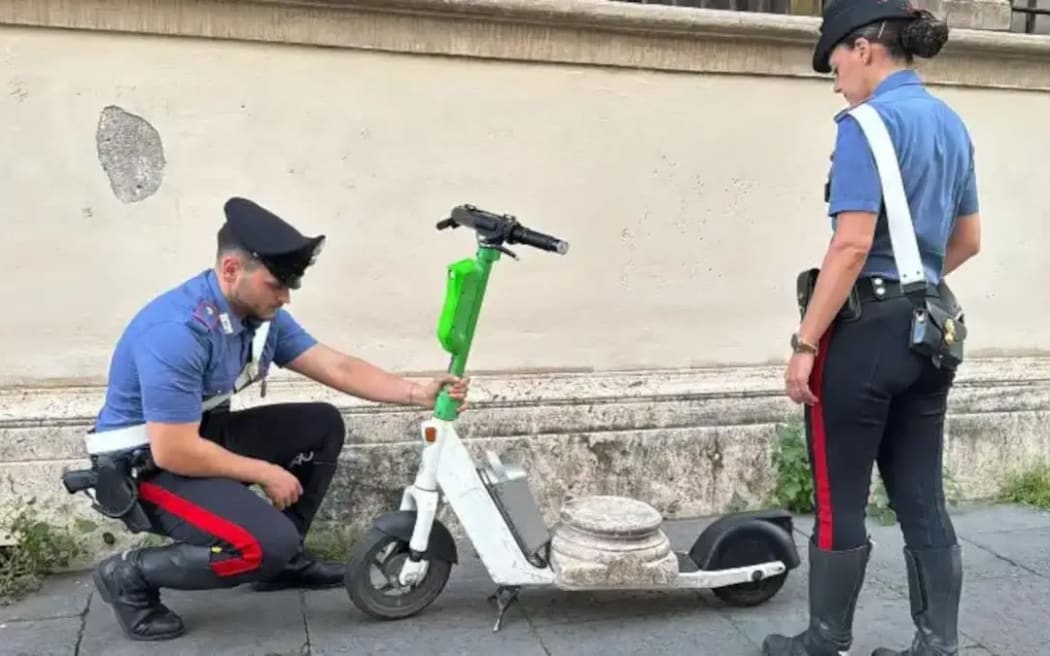 Police in Rome say they spotted the tourist riding along the Via Veneto near the US Embassy with the marble relic.