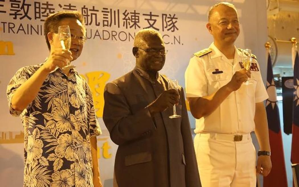 Taiwan Ambassador to Solomon Islands H.E Roger Luo, Prime Minister Manasseh Sogavare, and Commander Rear-Admiral Wang Cheng-chung up for the toast.