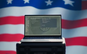 USA CIA agency using mass propaganda tools on laptop to influence population, engaging in psychological operations. Central intelligence agency commits PsyOp sabotage using device, camera A