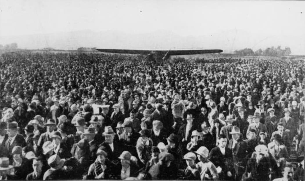 The wings of Kingsford-Smith's 'Southern Cross' visible in the crowd at Wigram Aerodrome, Christchurch, New Zealand.