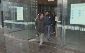 People leave the High Court in Christchurch after Brenton Tarrant pleads not guilty