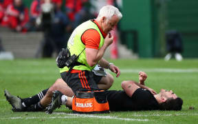 Nehe Milner-Skudder is tended to after dislocating his shoulder.