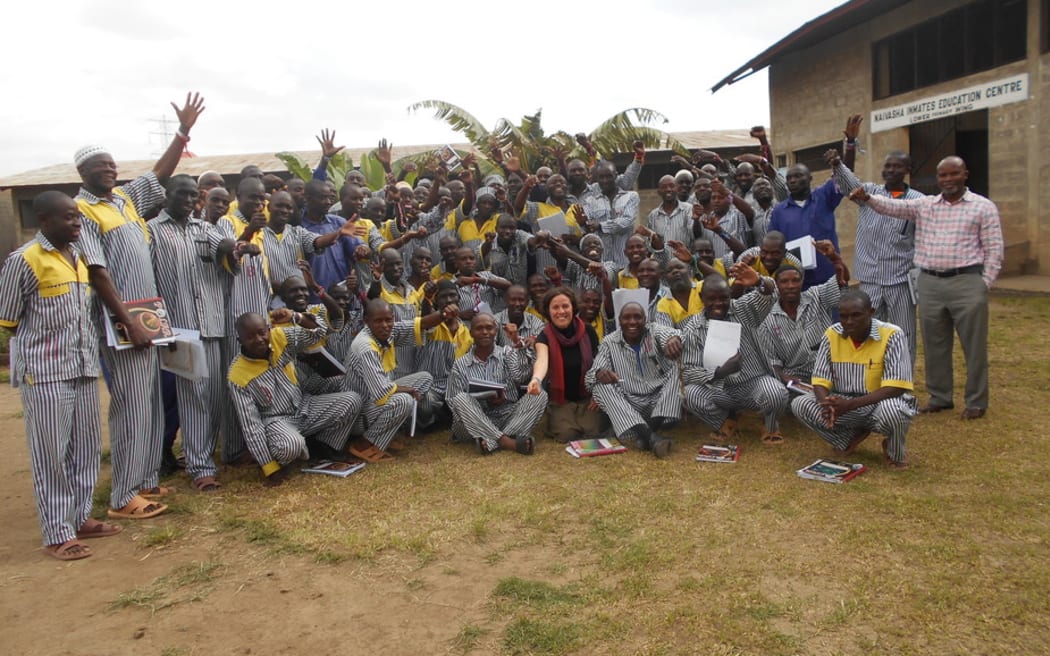 Inmates at a Kenyan prison wearing bracelets symbolising their new mindful leader identities. CREDIT:Joseph Mugatha