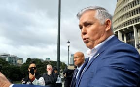 National MP Mark Mitchell confronts gang whānau on Parliament's forecourt.