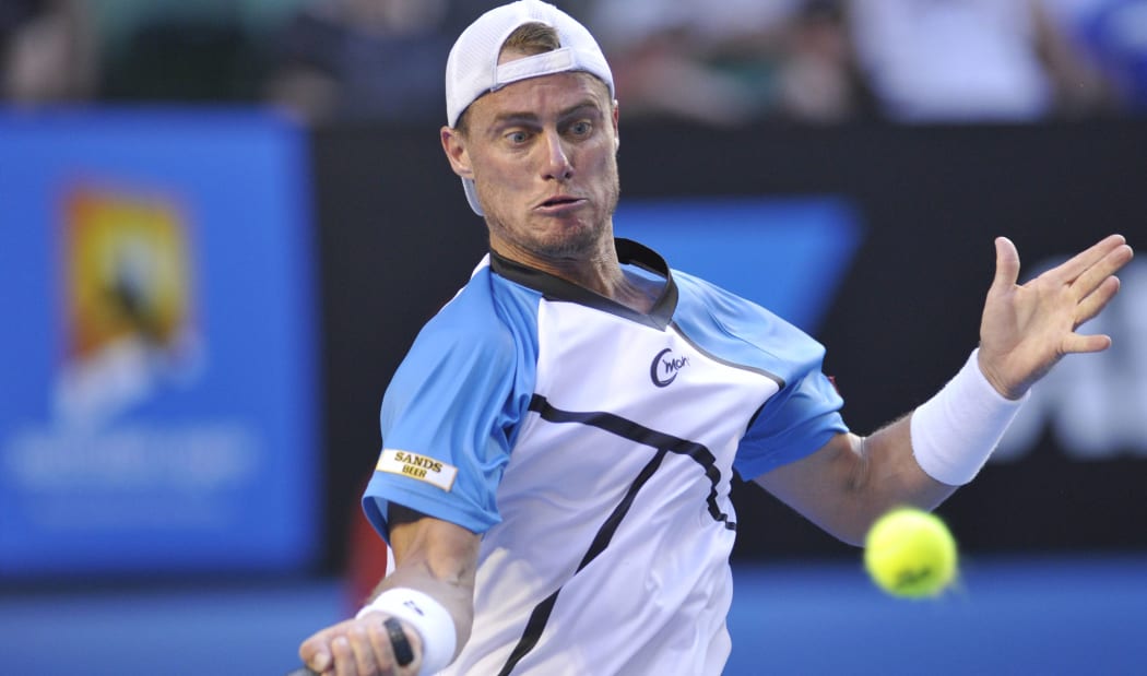 Australian tennis great Lleyton Hewitt plays a shot.