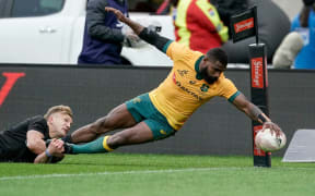 Marika Koroibete goes in to score for the Wallabies.