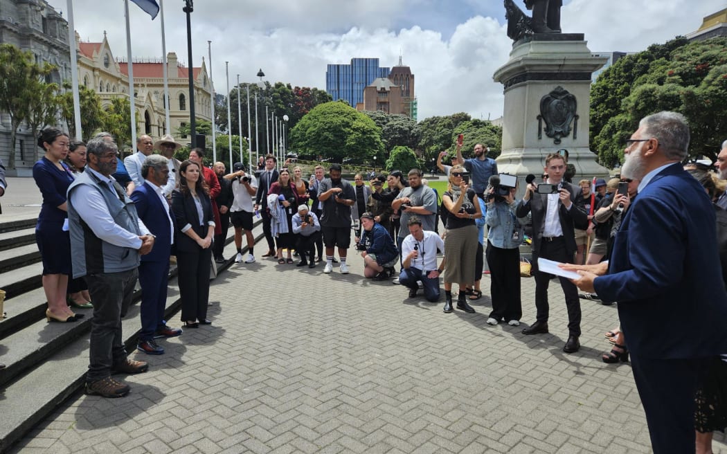Mātauranga Iwi Leaders Group Chair Rāhui Papa presents a 24,000 strong petition calling for the immediate reversal of the amendment that removed school boards' requirement to give effect to te Tiriti to Minister of Education Erica Stanford.