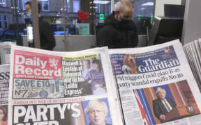 UK newspapers' front pages on the Downing Street Christmas party scandal.