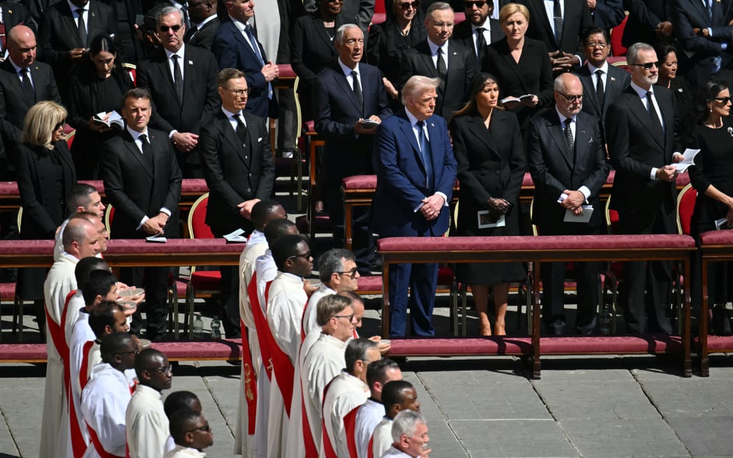 (L/R): France's President's wife Brigitte Macron, France's President Emmanuel Macron Finland's President Alexander Stubb, US President Donald Trump, US First Lady Melania Trump, Estonia's President Alar Karis, Spain's King Felipe VI and Spain's Queen Letizia stand during late Pope Francis' funeral ceremony at St Peter's Square at the Vatican on April 26, 2025. (Photo by Mandel NGAN / AFP)