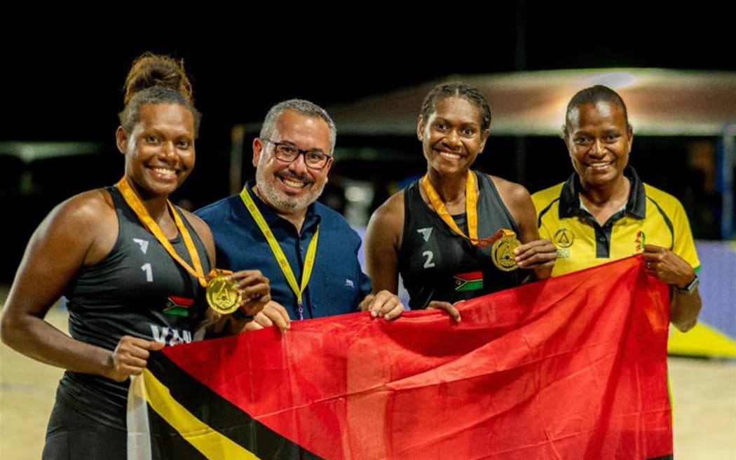 Vanuatu women’s beach volleyball team with FIVB president Fabio Azevedo, middle, after claiming the 2025 Pacific Mini Games gold medal in the final in Koror on 8 July 2025.