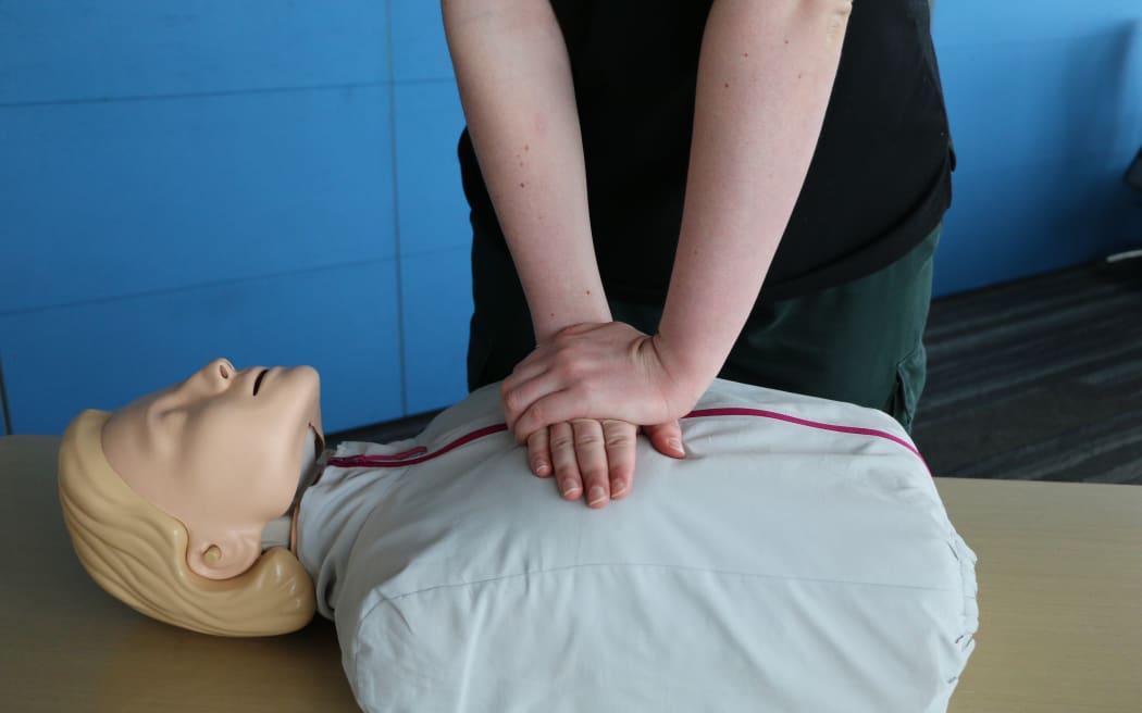 St John’s Three Steps for Life delivery lead Mia Noyes performing chest compression for CPR on a manikin.