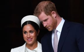(FILES) In this file photo taken on March 11, 2019 Britain's Prince Harry, Duke of Sussex (R) and Meghan, Duchess of Sussex leave after attending a Commonwealth Day Service at Westminster Abbey in central London. -