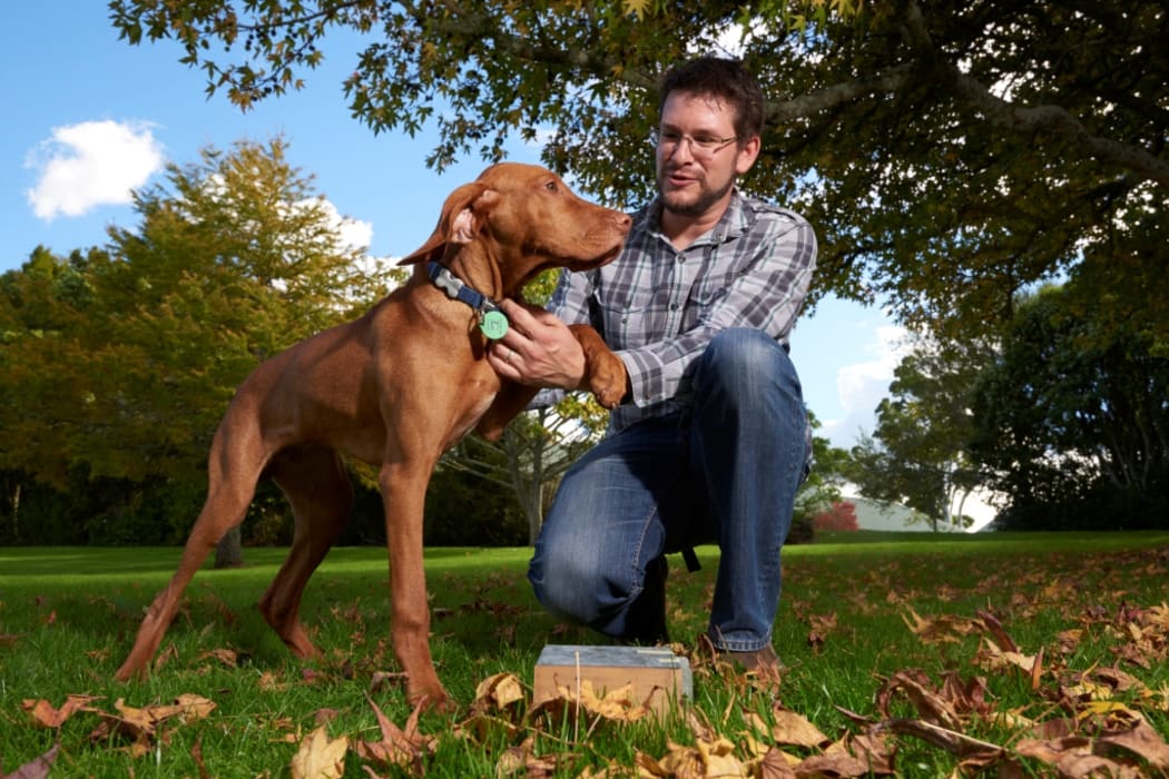 Photo of David Pattemore with Ollie, his bee-sniffing dog