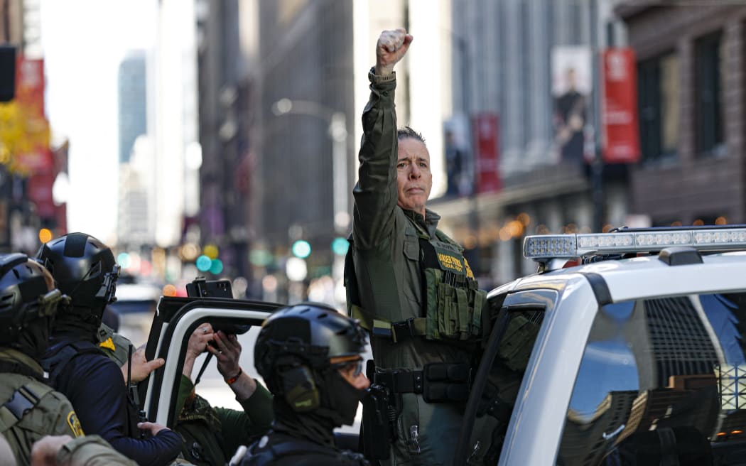 U.S. Customs and Border Protection Commander Gregory Bovino (C) leaves the federal courthouse in the Dirksen Federal Building after a hearing on October 28, 2025 in Chicago, Illinois. Bovino was ordered to appear in federal court for violating a temporary restraining order issued by District Judge Sarah Ellis that restricts immigration enforcement officers from using tear gas or other crowd control equipment unless there is an immediate threat. (Photo by Kamil Krzazynski/AFP)