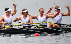 Members of the New Zealand men's rowing eight celebrate their win at the 2020 Tokyo Olympics.