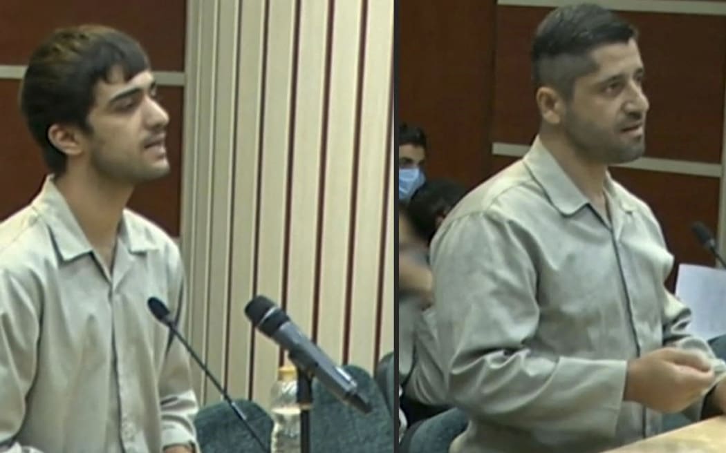 An image grab of footage obtained from Iranian State TV IRINN on 7 January 2023 shows Mohammad Mahdi Karami and Seyyed Mohammad Hosseini, who were executed for killing a member of Iran's Basij paramilitary force amid protests, attending a court hearing in Karaj on December 5. - The latest hangings double the number of executions to four over the nationwide protests, which escalated since mid-September into calls for an end to Iran's clerical regime.