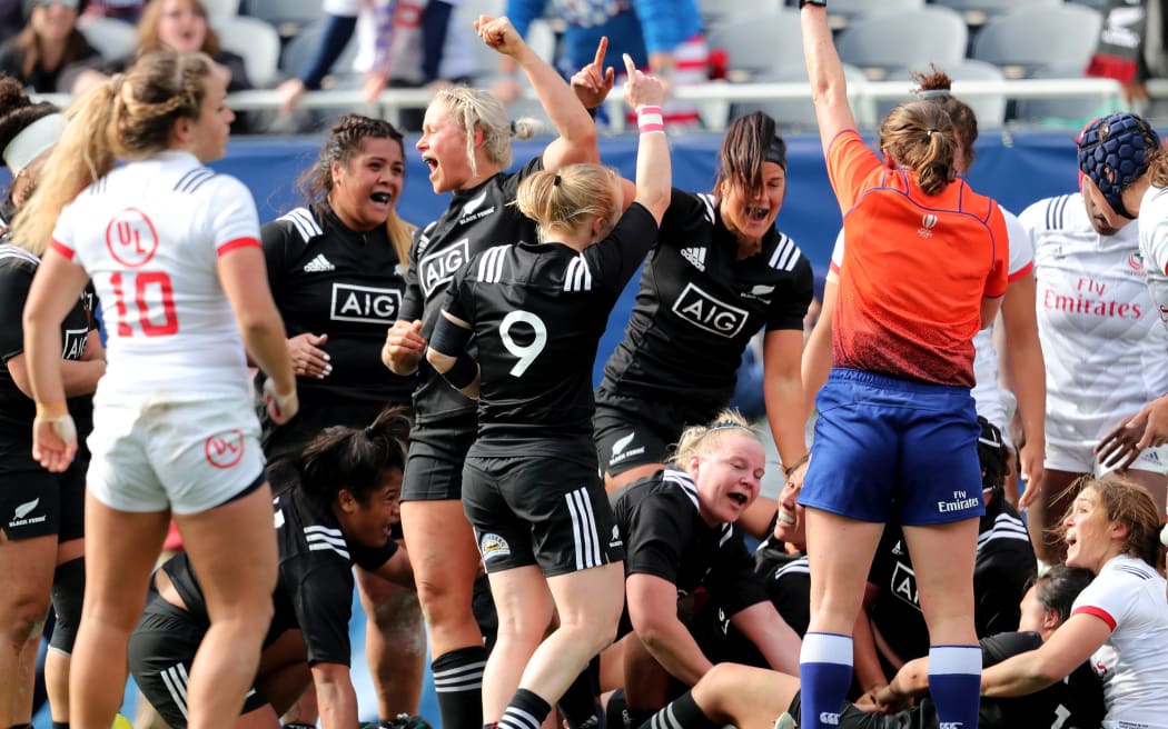 Black Ferns' players celebrate their third try.
